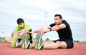 men stretching running track